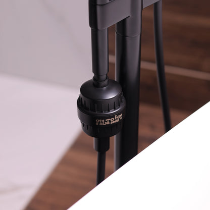 Filtrify jet black shower filter installed on shower hose | variant:jet-black