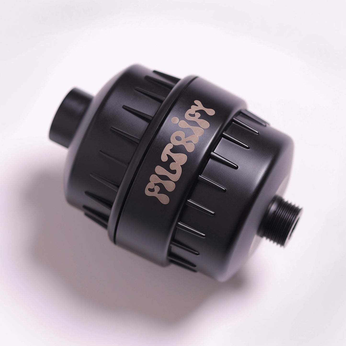 Filtrify jet black shower filter – close-up on white background | variant:jet-black